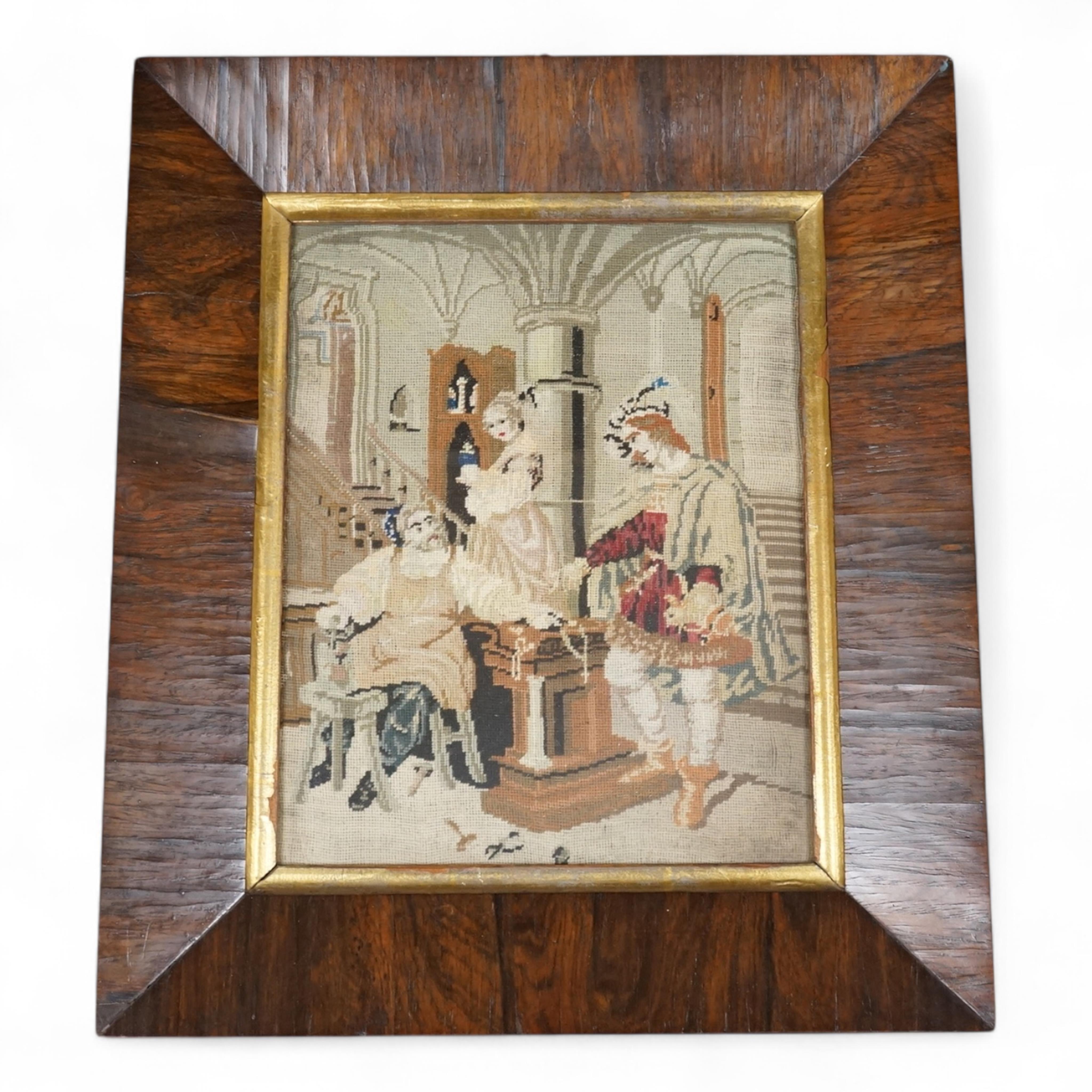 A rosewood framed 19th century Berlin wool worked figurative interior scene. 26cm x 20cm.